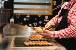 Extrawurst kicks off New Street opening by giving away 100 FREE bratwurst in a bun