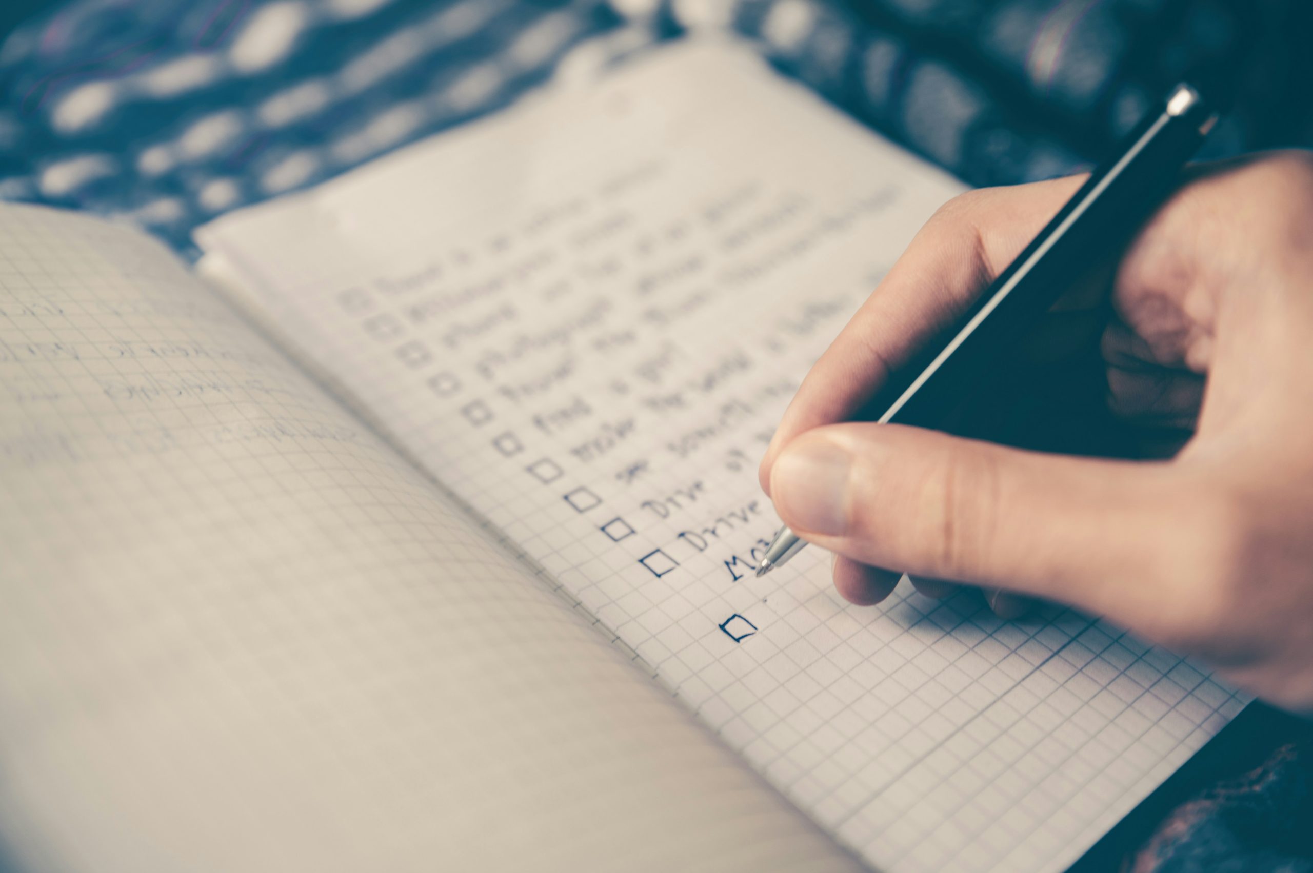 A person planning a move with a checklist