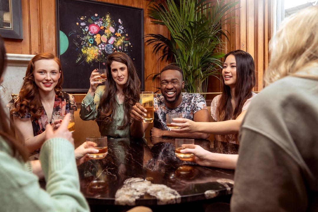 Alt text: Friends socializing at a stylish evening bar lounge